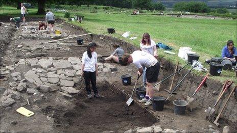 Durham University students excavating the remains of a late Roman tanning pit outside the Roman fort at Binchester. Photo: Durham University.