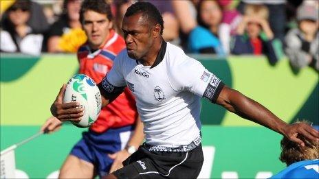 Fiji's Vereniki Goneva steps through the tackle of Namibia's Conrad Marais