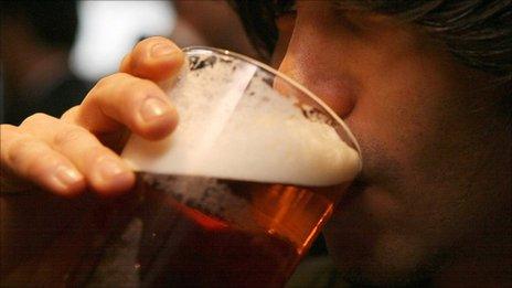 Man drinking a pint of beer