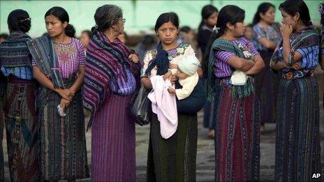 Women wait in a line to vote during the general elections in Santiago Atitlan, Guatemala, 11 September 2011