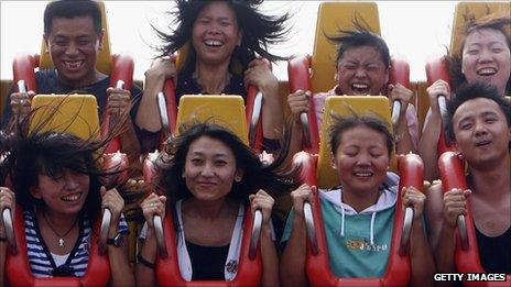 Thrillseekers on a ride at the Happy Valley theme park in Beijing