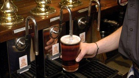 Man pulling pint