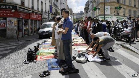 Muslims pray in a Paris street, 5 August 2011