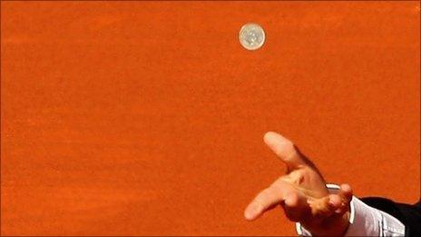 Coin being tossed at the Madrid tennis open