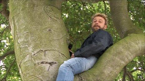 Mark Snow sitting in a beech tree at Irton near Scarborough