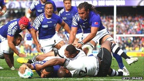 Kahn Fotuali'i of Samoa goes over to score their first try