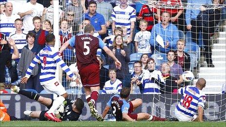 Richard Dunne (centre) scores a late own goal for QPR