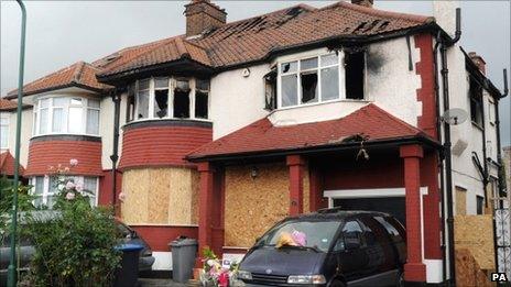 Tributes left outside the house in Neasden