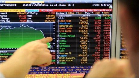 Trader in Melbourne points to data on his screen