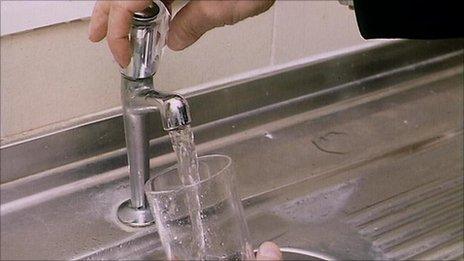 Filling a glass with water from a tap