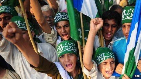 Activists of Jamaat-e-Islami Pakistan shout slogans during a protest in Karachi on September 11, 2011, on the 10th anniversary of the Sept 11 attacks in US