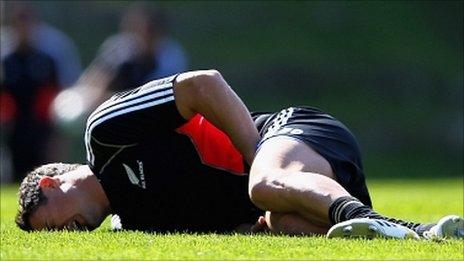 Dan Carter shows the pain after suffering a groin injury in training