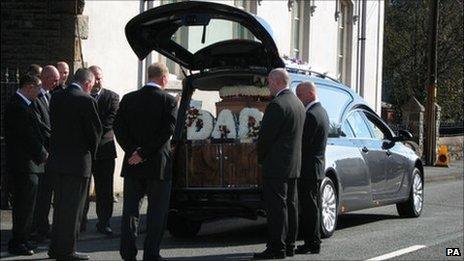 Mourners at the funeral of Garry Jenkins in Lower Cwmtwrch.