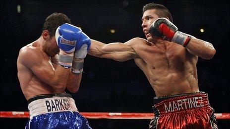 Darren Barker (left) is hit by Sergio Martinez