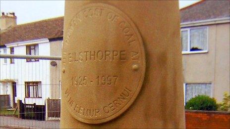 The eight-foot sandstone Davy lamp memorial at Bilsthorpe in recognition of the miners who died in the 1927 and 1997 disasters