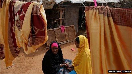 Ardo Ahmed's friends outside her hut