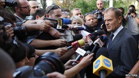Polish Prime Minister Donald Tusk speaks to reporters in Warsaw, 26 September