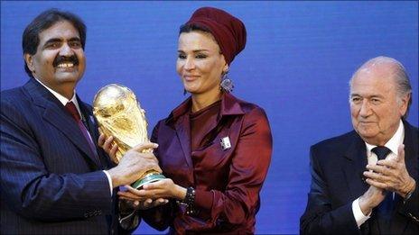 Qatar delegates celebrate after being awarded the 2022 World Cup hosting rights