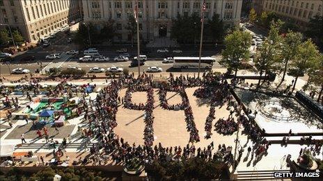 Protesters organise themselves into a 99% symbol in Freedom Plaza in Washington DC, 6 October 2011