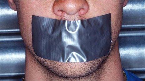 Mouth with tape over it