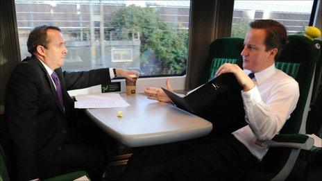 Liam Fox and David Cameron on a train last year