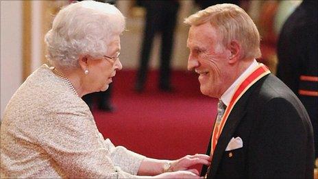 Sir Bruce Forsyth receives his knighthood from the Queen