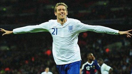 Peter Crouch celebrates his goal for England against France in November 2010