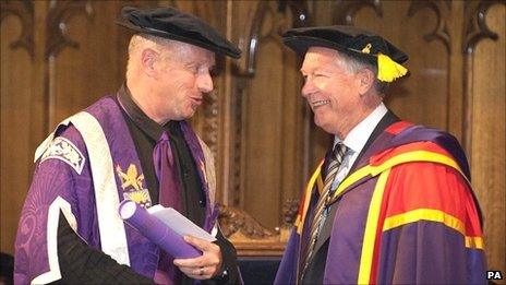 Manchester United manager Sir Alex Ferguson (right) receiving an honorary degree from The University of Manchester by University's Deputy President and Deputy Vice-Chancellor Professor Rod Coombs (left)