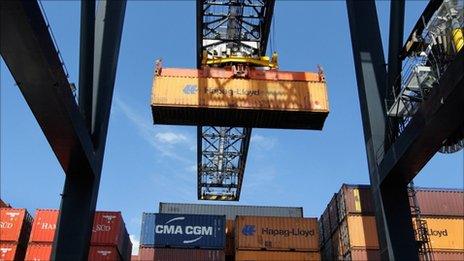 Cargo containers being moved at a port