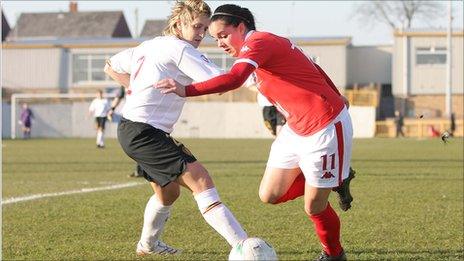 Wales' Gwennan Harries goes past Belgium's Maud Coutereels in the UEFA Women's Championship 2009