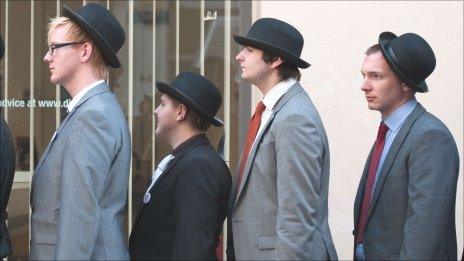 Men in bowler hats at unemployment protest