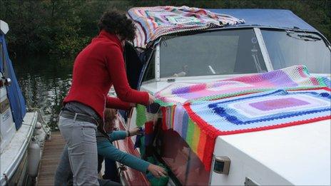 Boat covered in knitting, Milestones Trust