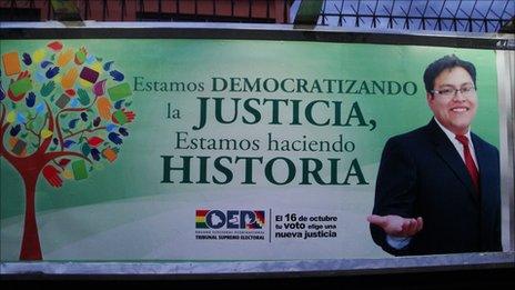 Election poster: "We are democratising justice, we are making history"