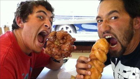 Dave and friend eating doughnuts