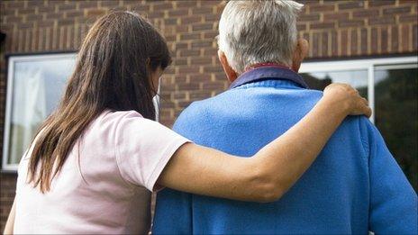 Elderly man with carer