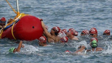 Swimmers take part in the Hong Kong harbour race, 16 Oct