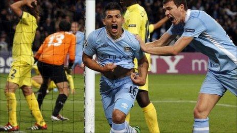 Manchester City's Sergio Aguero (left) celebrates his goal against Villarreal with Edin Dzeko