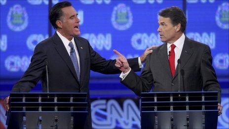 Mitt Romney and Rick Perry in the CNN Republican debate on 18 October 2011