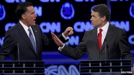 Mitt Romney and Rick Perry in the CNN Republican debate on 18 October 2011