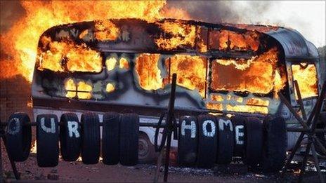 Flames engulf a caravan during evictions from Dale Farm travellers camp on 19 October, 2011