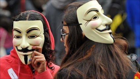 Protesters wearing Guy Fawkes masks gather outside St Paul Cathedral in the city of London on October 16, 2011 as part of a global day of protests inspired by the 'Occupy Wall Street' and 'Indignant' movements