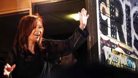 Cristina Fernandez greets supporters after her election victory