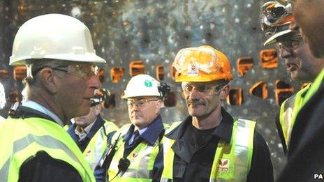 Prince Charles speaking to steel workers