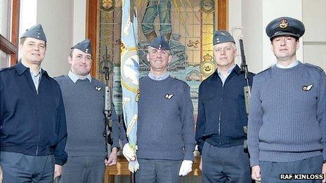 Former 201 Squadron members with standard. From left to right; Master Aircrewman Keith Treece, Sgt Simon Bliault, Flt Lt Dave Irvine, Flt Sgt Justin Morris and Sqn Ldr Andy Holden