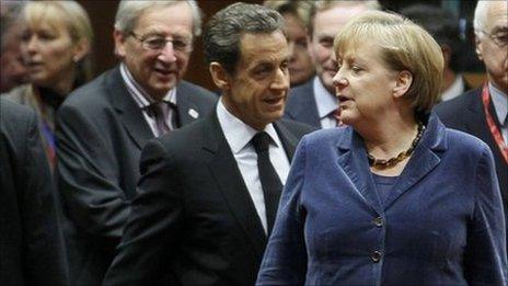 Luxembourg Prime Minister Jean-Claude Juncker (L), French President Nicolas Sarkozy (C) and German Chancellor Angela Merkel (R) attend an European Union summit in Brussels, 26 October 2011