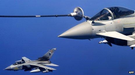 A British Tornado jet and Eurofighter refuel above the Mediterranean sea