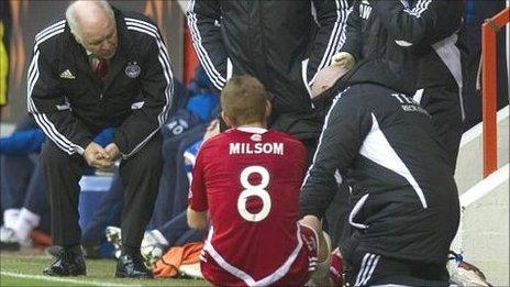 Craig Brown assesses the damage to Rob Milsom's leg