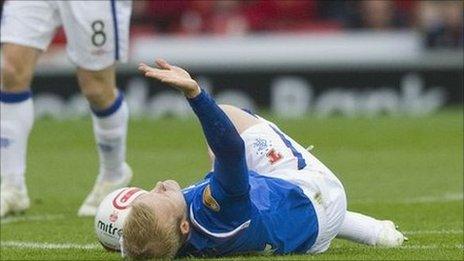 Steven Naismith seeks attention from the Rangers physio