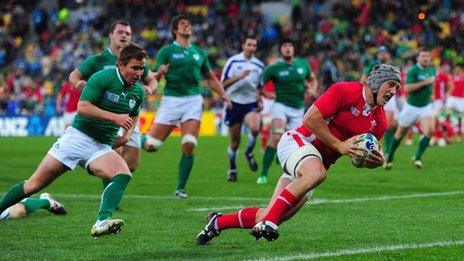 Jonathan Davies scores a try against Ireland in a quarter final match during the 2011 Rugby World Cup