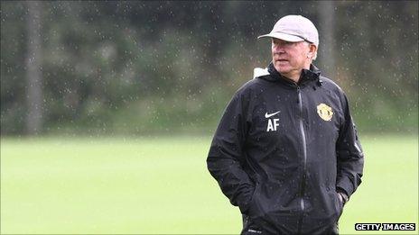 Sir Alex Ferguson watches his team in training